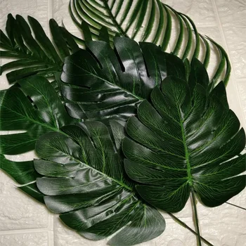 Tropical palm jätab monstera lehed Kunstlik taim Kodu Aias Decors Tarvikud Havai Luau Pulmapidu tabeli teenetemärgid